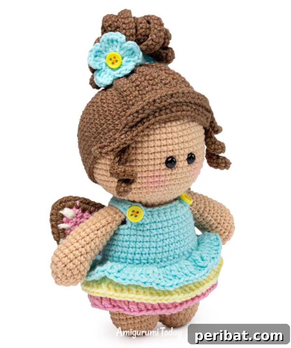 33 Cuddly Amigurumi Friends to Crochet 3 Adorable amigurumi doll gracefully posing in a delicate butterfly dress, perfect for imaginative play or a unique gift.