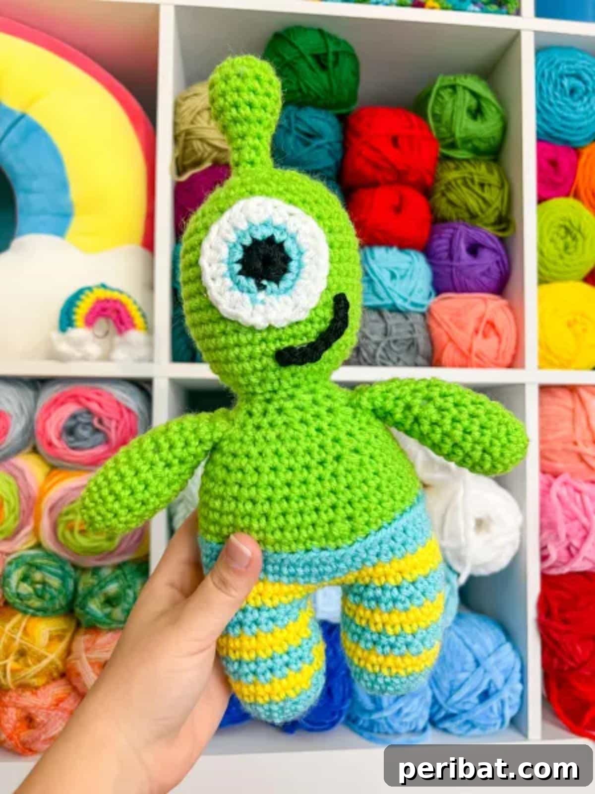 33 Cuddly Amigurumi Friends to Crochet 26 A cute and friendly alien amigurumi with large expressive eyes and vibrant green skin, ready for a galactic adventure.