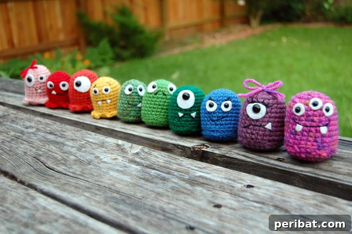 33 Cuddly Amigurumi Friends to Crochet 27 A collection of cute baby monsters amigurumi, featuring various shapes, googly eyes, and fuzzy textures.