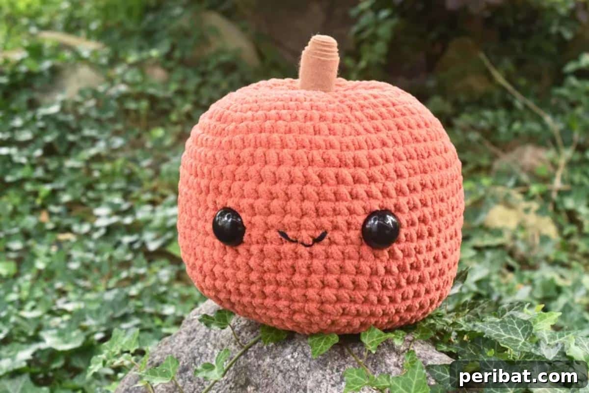 33 Cuddly Amigurumi Friends to Crochet 32 A beautifully textured crochet pumpkin in a rich orange hue, perfect for autumn decorations.
