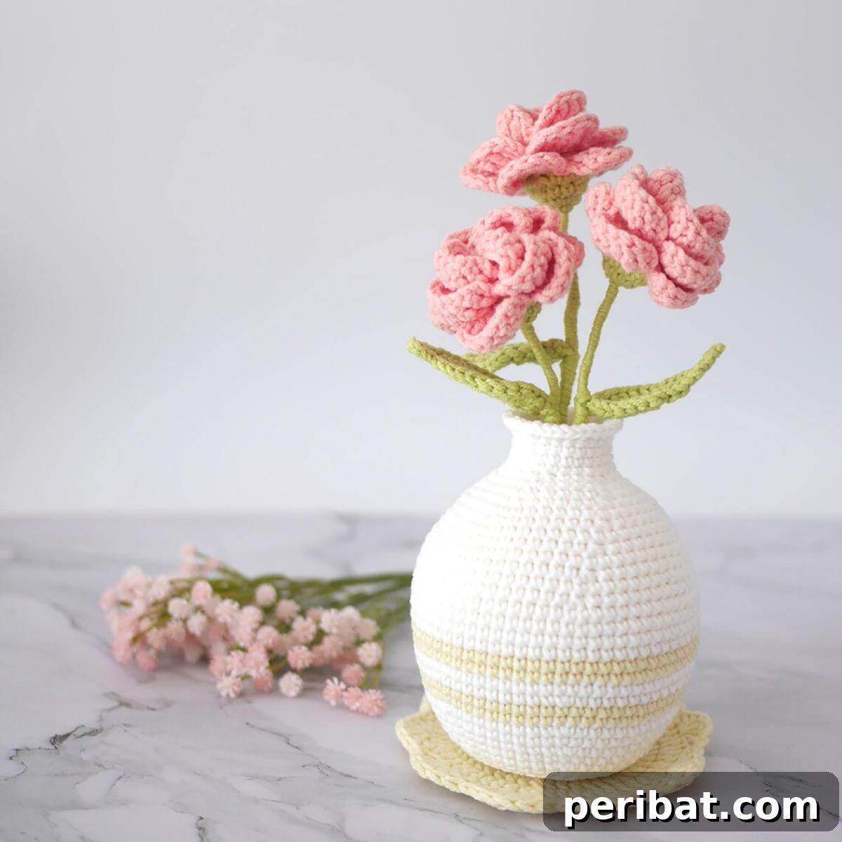 33 Cuddly Amigurumi Friends to Crochet 34 A unique rose vase crochet amigurumi, where roses form the 'head' of a stylized vase figure.