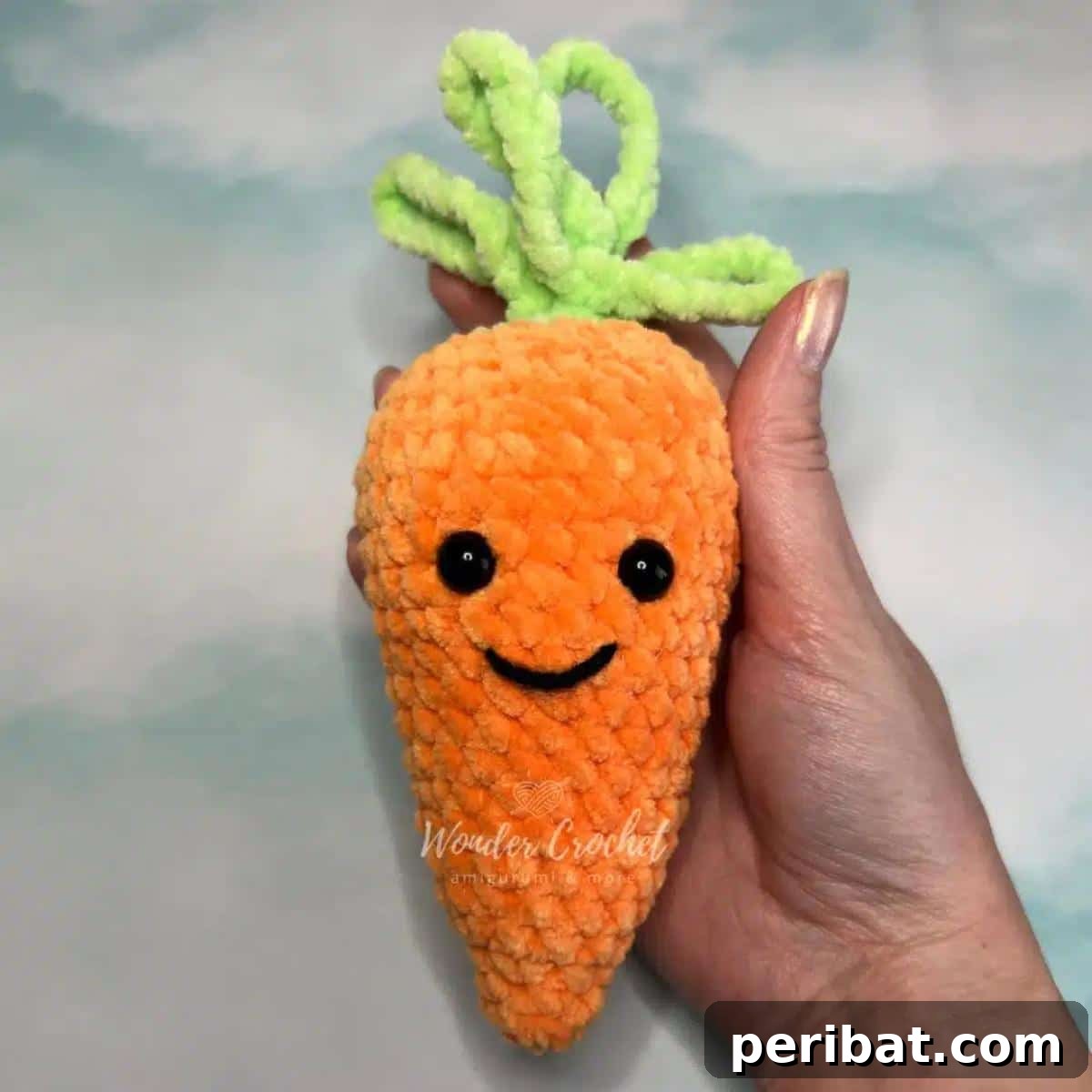 33 Cuddly Amigurumi Friends to Crochet 9 A small, cute, and easy-to-crochet no-sew amigurumi carrot, featuring vibrant orange and green hues.