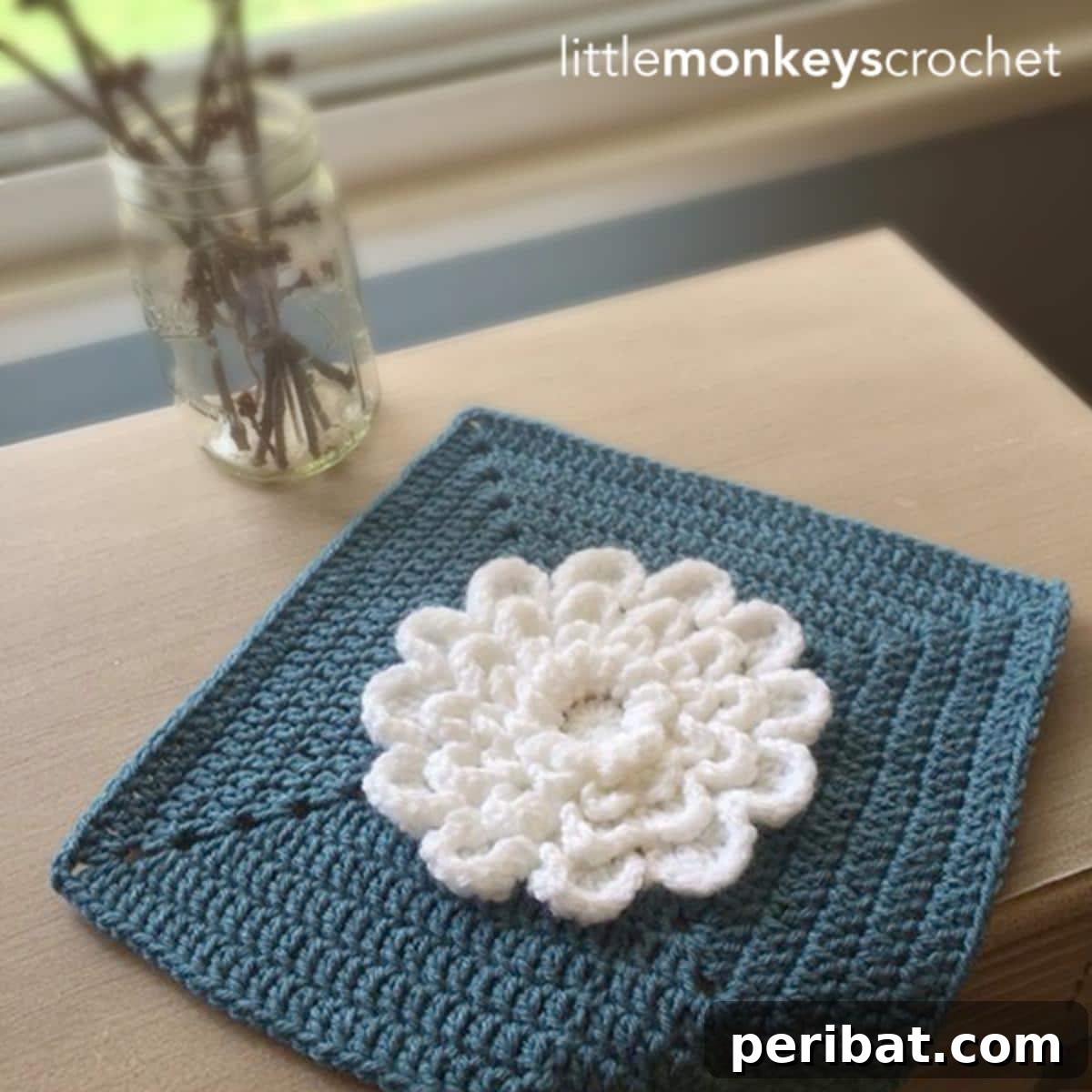 An intricate crochet 'Never Ending Wildflower' displaying continuous, spiraling growth.