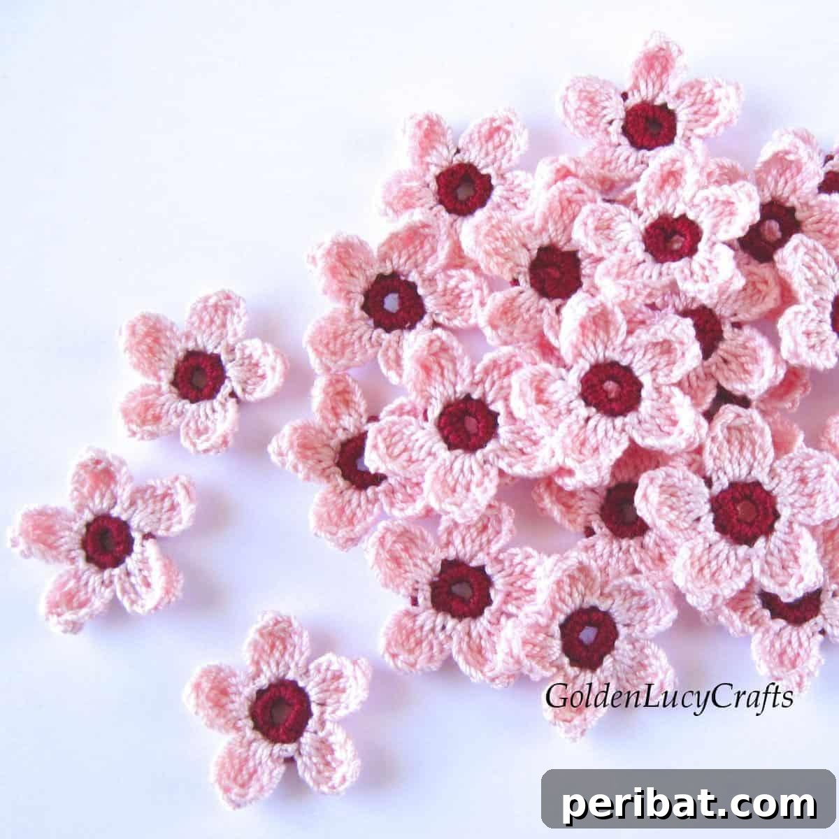 Delicate pink crochet cherry blossoms, evoking the beauty of spring.