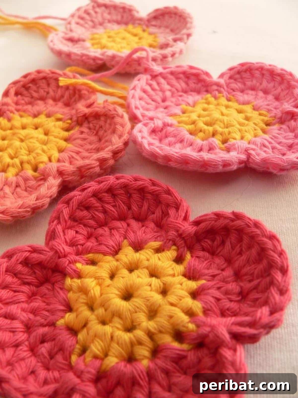 A vibrant collection of simple crochet flowers in various colors, perfect for quick crafting.