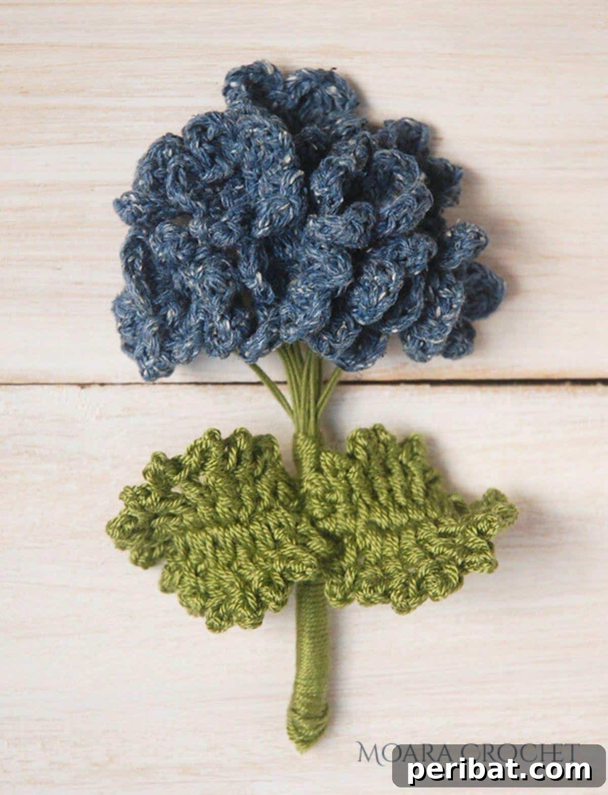 A lush crochet hydrangea cluster, capturing the voluminous beauty of the real flower.