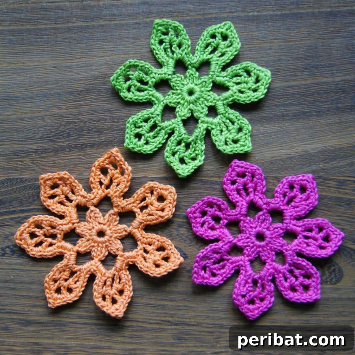 A vibrant crochet 'Tahiti Blossom' with multiple petals, evoking tropical beauty.