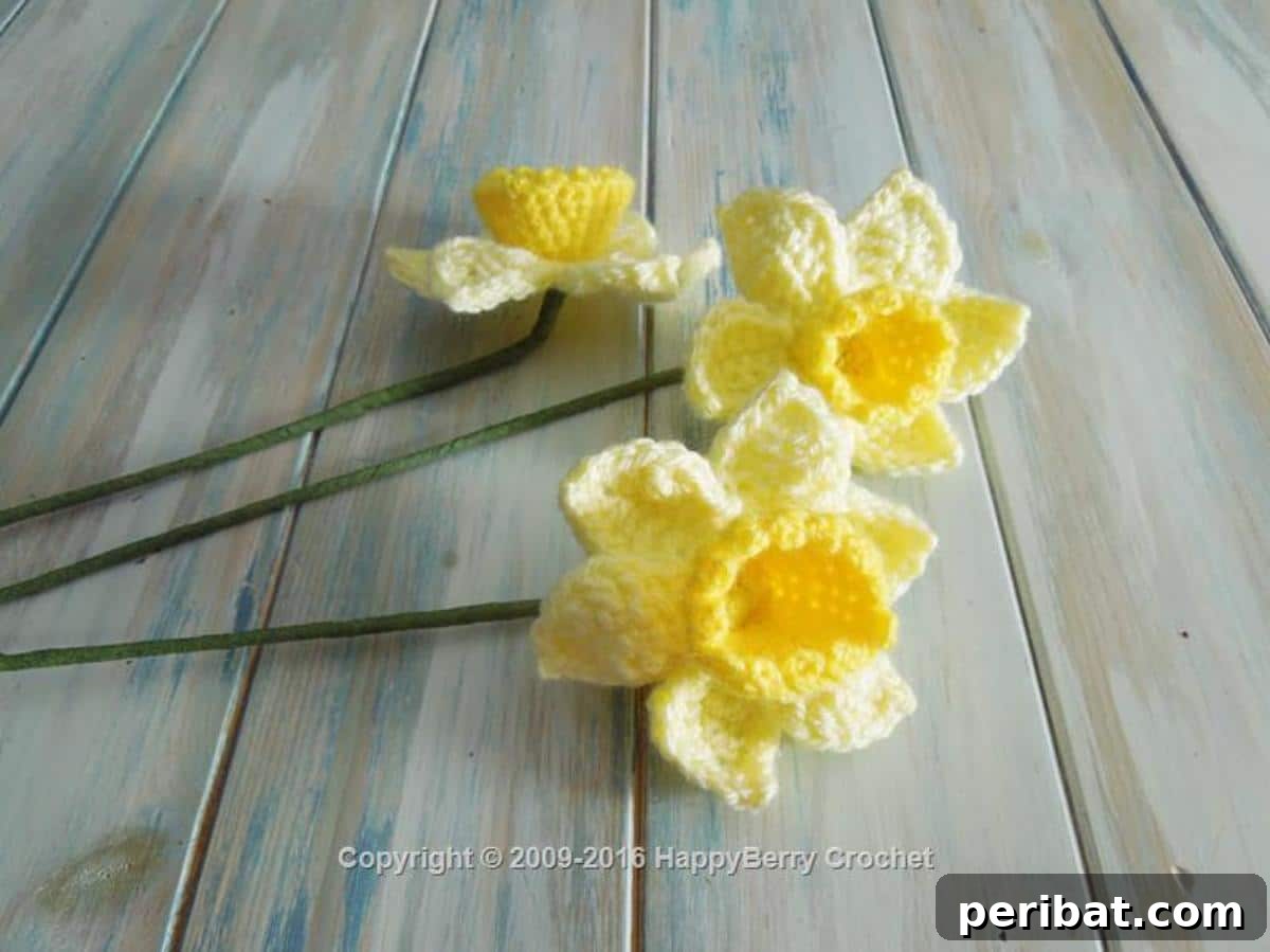 Cheerful crochet spring daffodils in yellow and orange, capturing the essence of the season.
