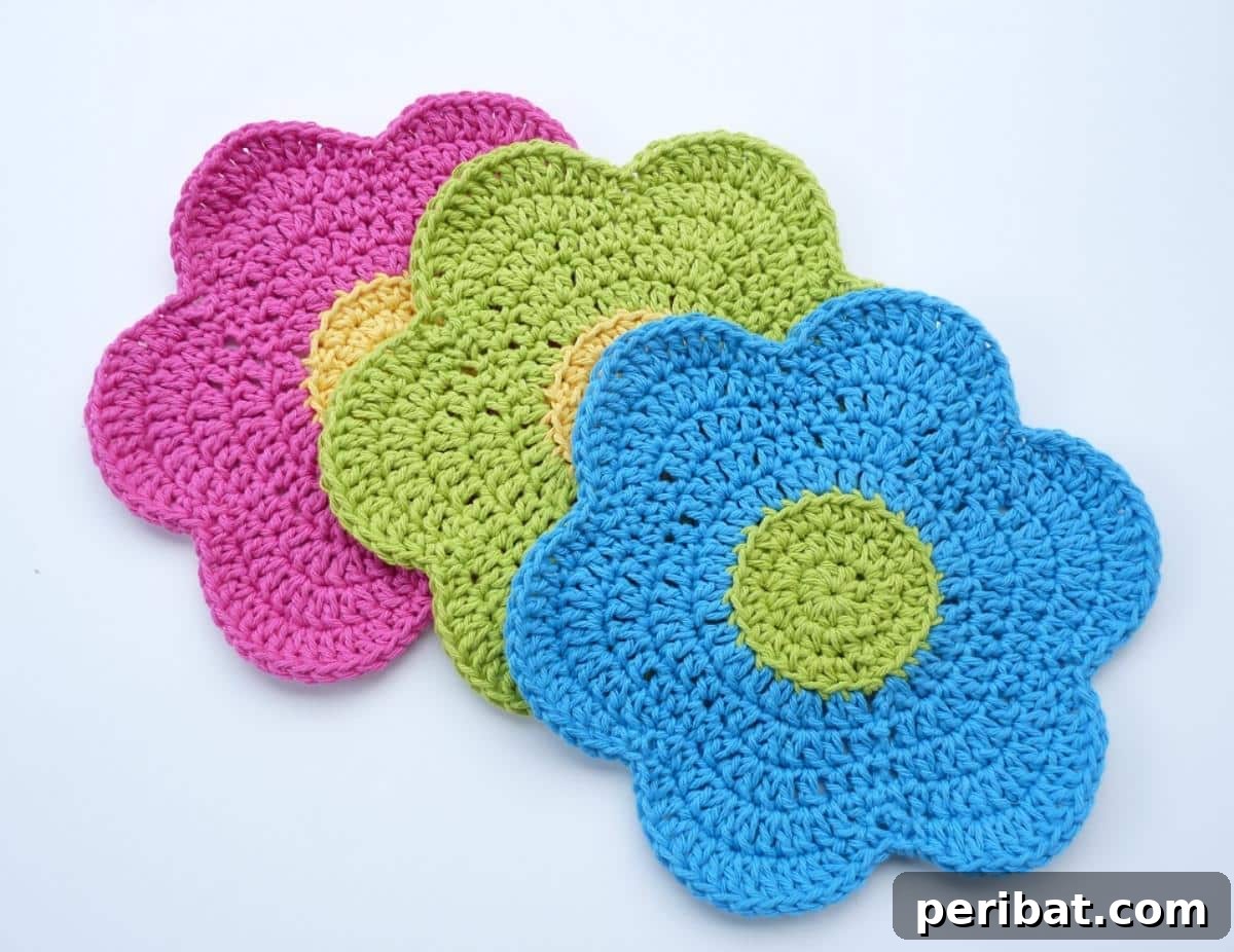 A colorful array of 'Flower Power' crochet dishcloths, adding vibrant floral design to kitchen essentials.