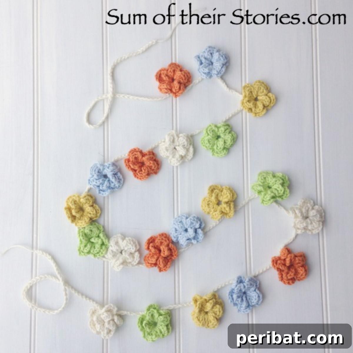 A beautiful crochet flower garland, featuring various colorful blooms strung together.