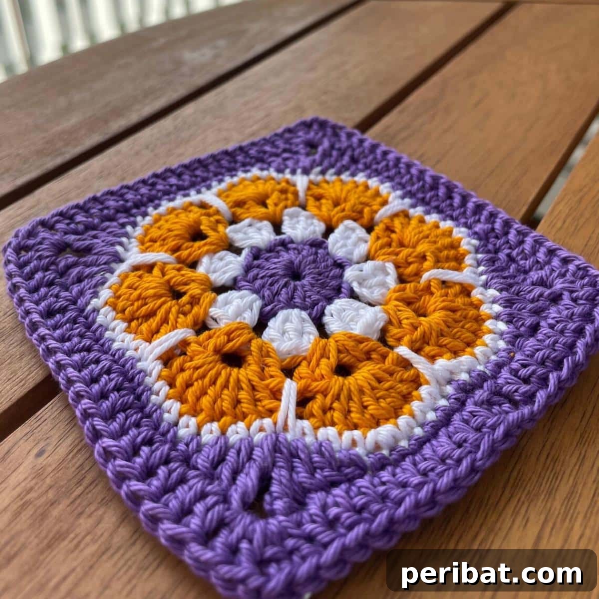 38 Creative Crochet Square Designs 38 A versatile crochet granny square African flower pattern for various garments.