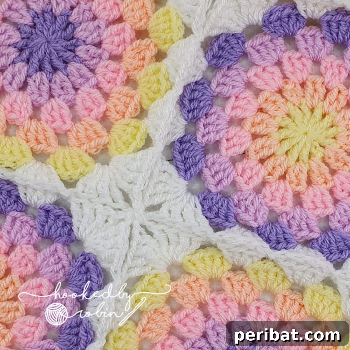 38 Creative Crochet Square Designs 7 A charming crochet motif featuring a pastel circle within a square frame.