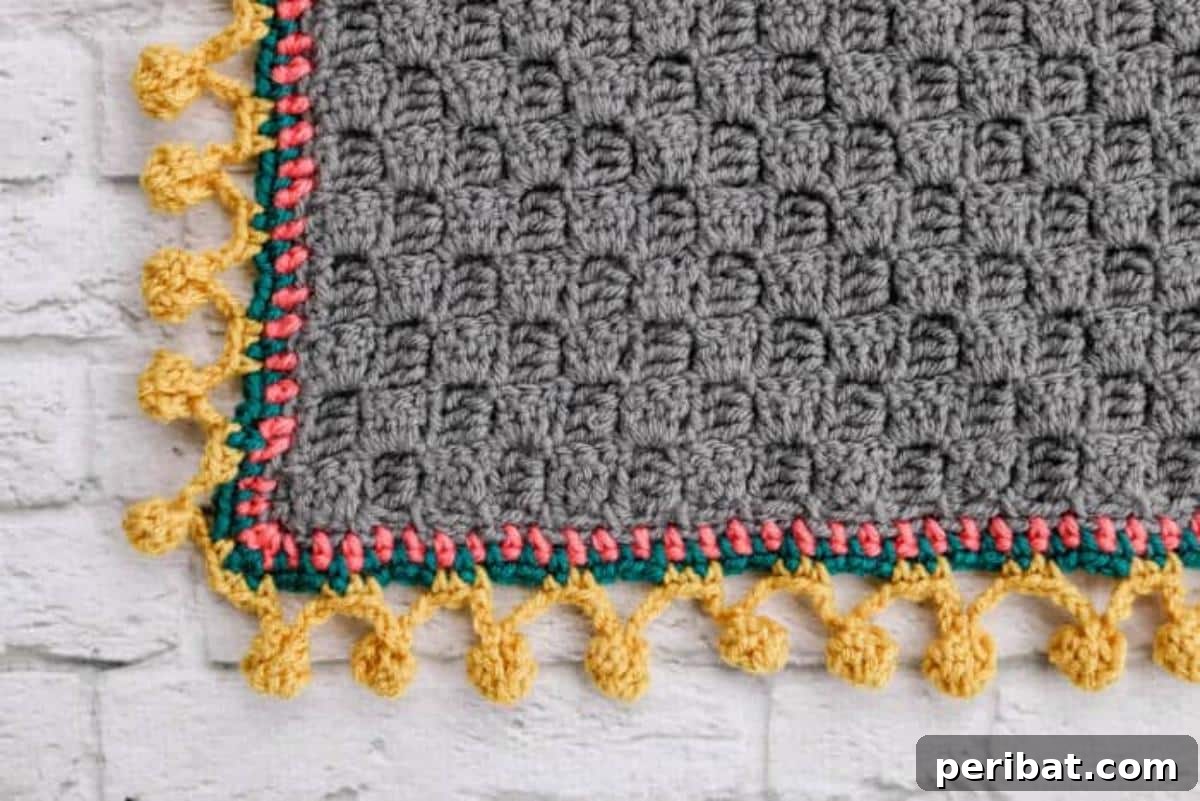 37 Stunning Crochet Edging Designs 15 Pom-Pom Crochet Border Stitch adding a playful and textured look.