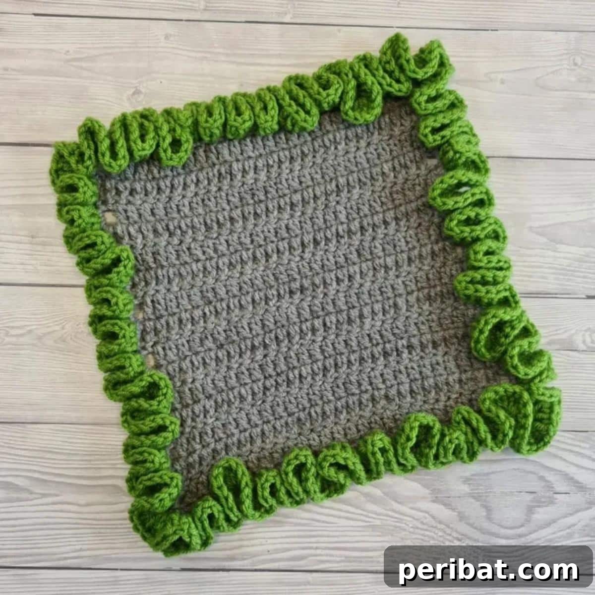 37 Stunning Crochet Edging Designs 21 Ruffled Edge Blanket Border creating a soft and romantic finish.