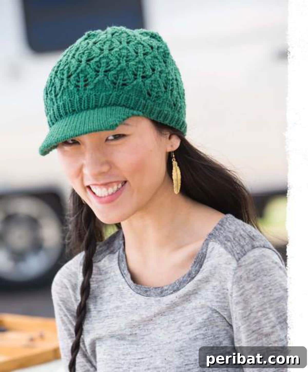 Cozy Knits: 40 Free Beanie Patterns and Tutorials 24 The elegant Cascading Leaves Hat, a knitting pattern featuring a unique leaf motif that appears to flow from the crown, available in both fitted and fuller newsboy styles.