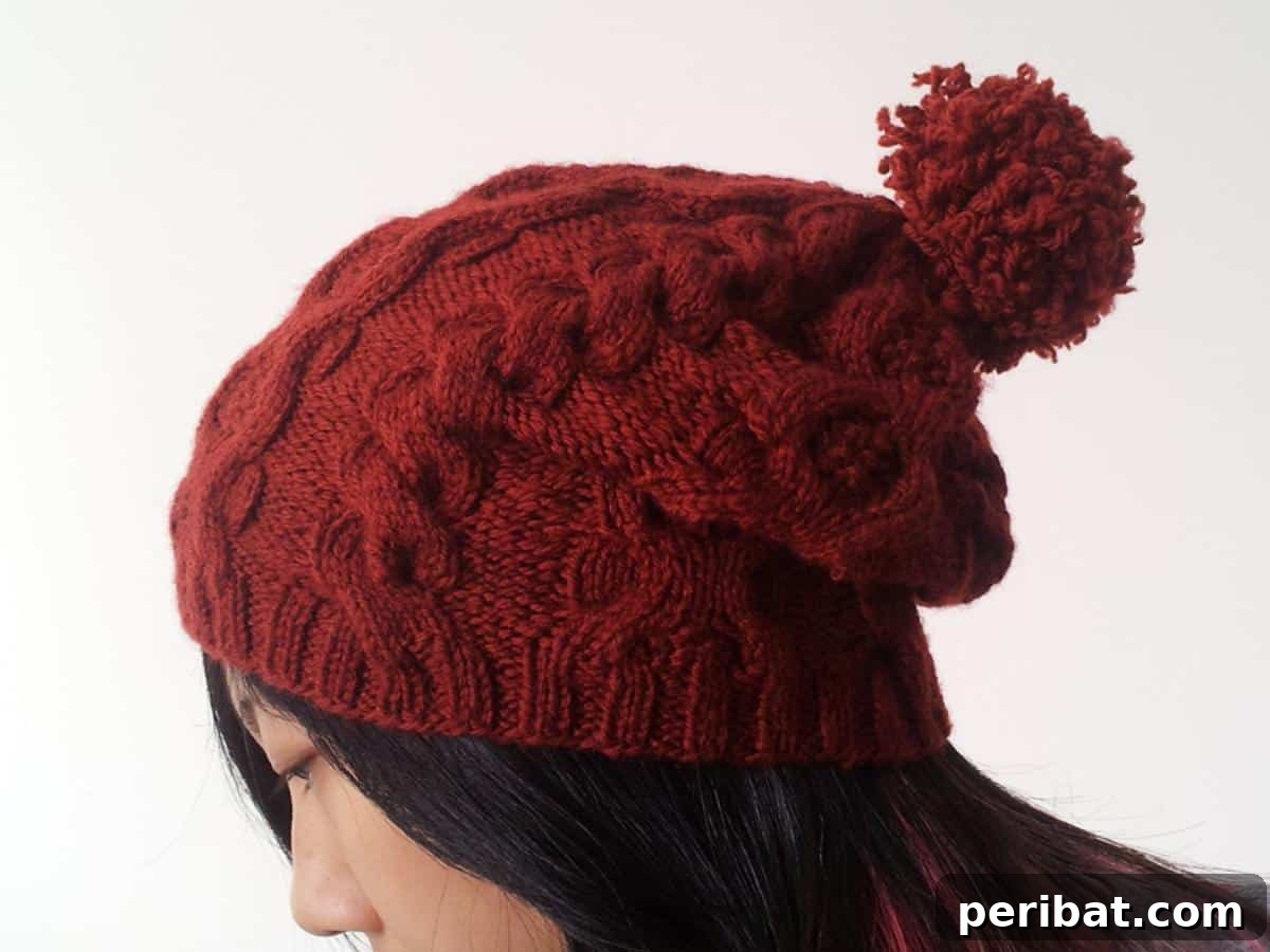Cozy Knits: 40 Free Beanie Patterns and Tutorials 34 A free DIY Cabled Slouch Beanie knitting pattern, allowing for the addition of a pom-pom and personal touches to customize its stylish, relaxed look.