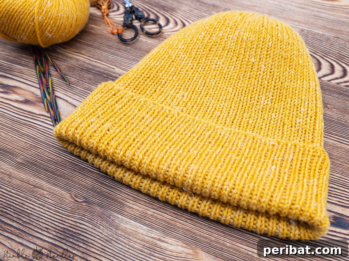 Cozy Knits: 40 Free Beanie Patterns and Tutorials 8 An easy-to-follow knitting pattern for a classic men's beanie, emphasizing the importance of high-quality wool for a sophisticated and comfortable result.
