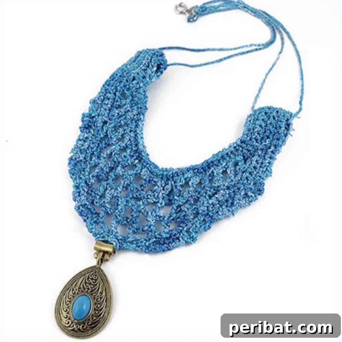 Heirloom Crochet: 40 Timeless Patterns 14 Luxurious Antoinette Vintage Statement Necklace featuring an antique-looking hanging pendant, perfect for adding chic elegance to formal wear.