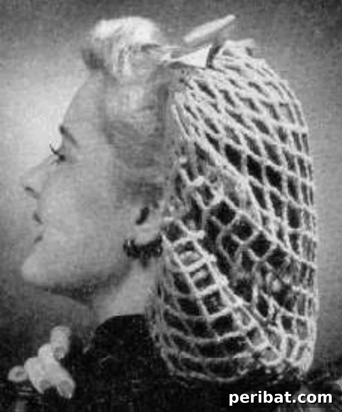 Heirloom Crochet: 40 Timeless Patterns 36 Playful Vintage Crochet Perky Snood, a unique hair accessory that captures the essence of retro fashion and has successfully stood the test of time, proving its enduring style.