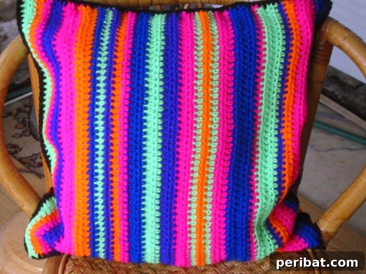 Heirloom Crochet: 40 Timeless Patterns 10 Vibrant Neon Retro Cushion Pillow Cover, showcasing bold colors and a geometric crochet design that brings an 80s aesthetic to home decor.