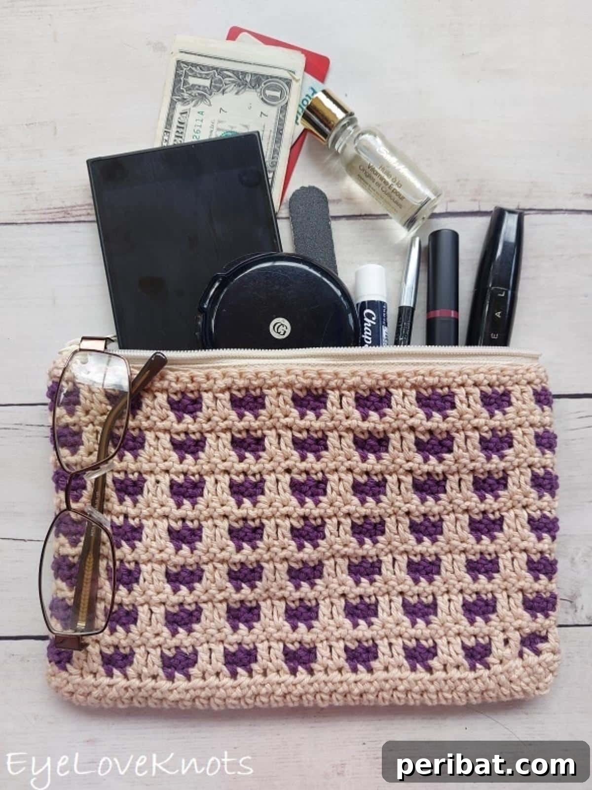 29 Creative Mosaic Crochet Patterns 12 Through the Window Cosmetic Bag or Hook Pouch - A versatile and stylish pouch with a unique mosaic crochet design, perfect for organizing cosmetics or crochet hooks.