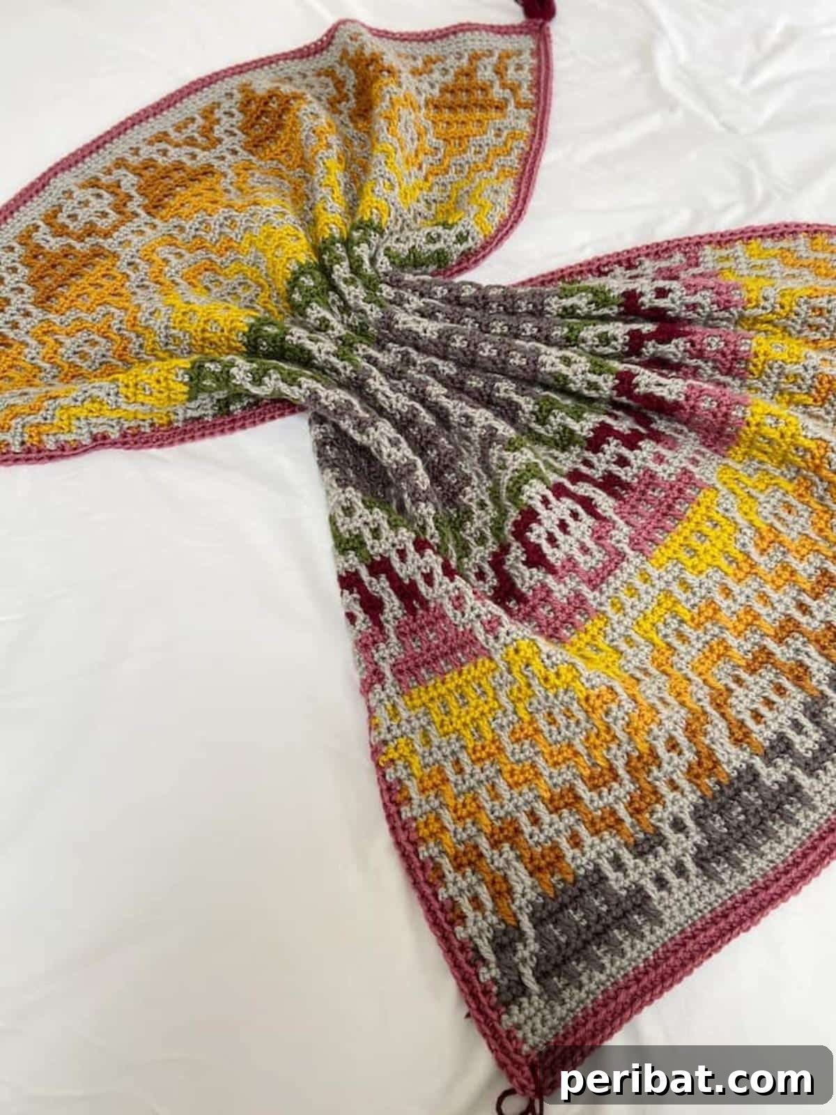 29 Creative Mosaic Crochet Patterns 23 Wanderers Crochet Blanket - A large, cozy blanket with a complex geometric mosaic crochet pattern, perfect for a statement piece in home decor.