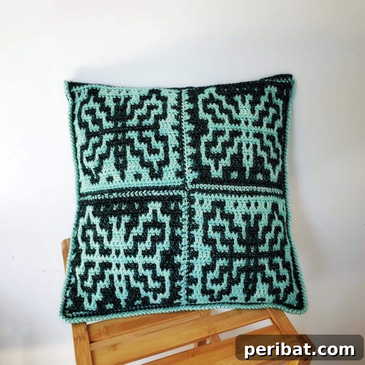 29 Creative Mosaic Crochet Patterns 7 Butterfly Crochet Mosaic Pillow - A decorative throw pillow featuring an intricate butterfly mosaic pattern, adding an elegant touch to home decor.