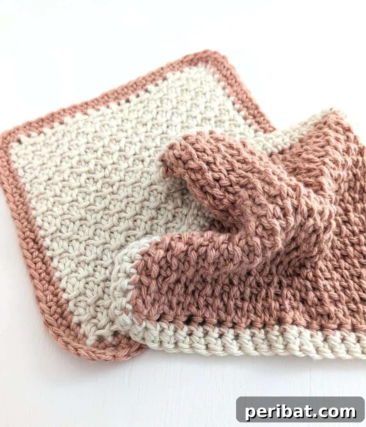 29 Beautiful Tunisian Crochet Projects 19 Tunisian Crochet Honeycomb Washcloth, featuring a dense and textured honeycomb pattern for effective cleaning.