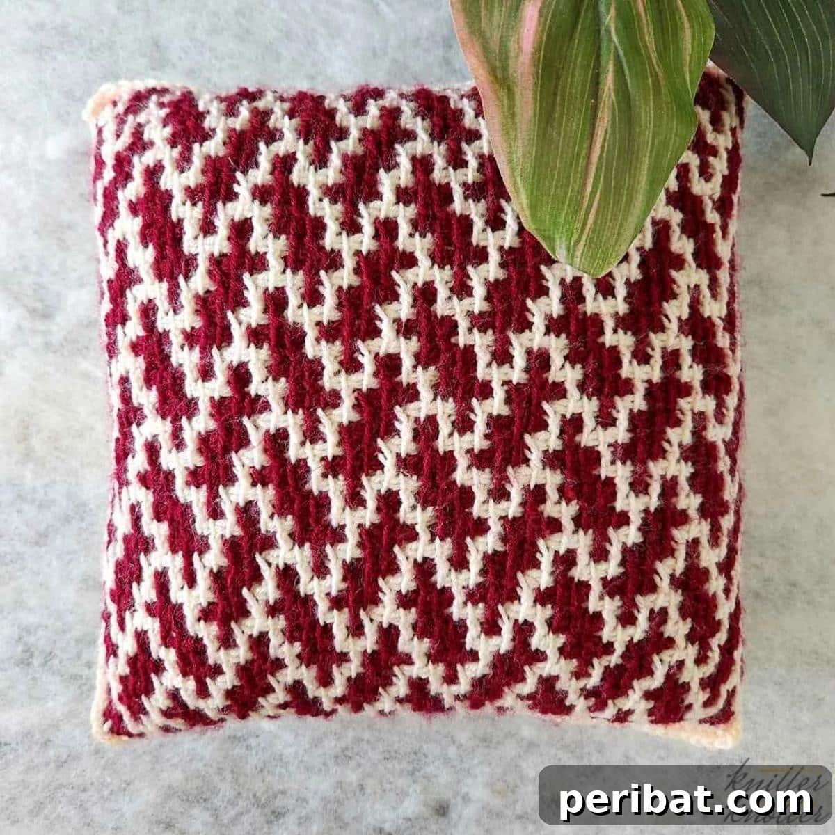 29 Beautiful Tunisian Crochet Projects 20 Latika Tunisian Mosaic Pillow, displaying a captivating geometric mosaic pattern that adds vibrant style.