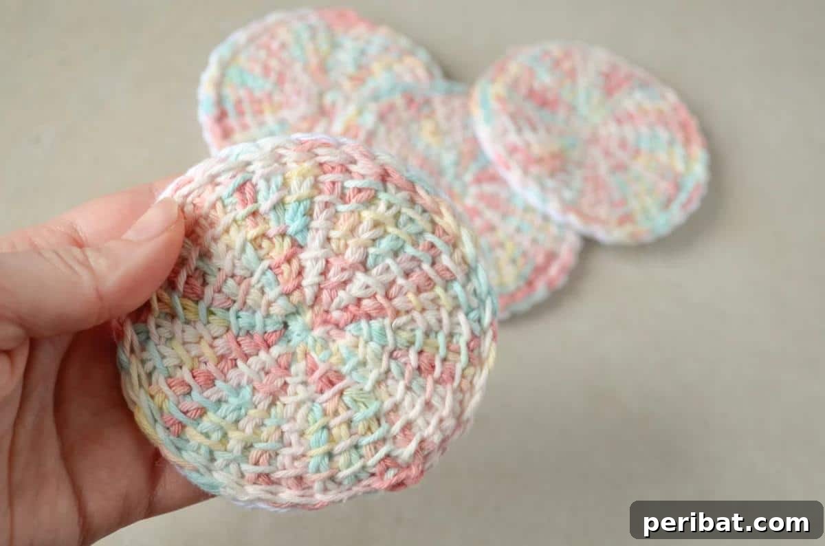 29 Beautiful Tunisian Crochet Projects 26 Tunisian Crochet Face Scrubbies, soft and durable reusable alternatives for an eco-friendly skincare routine.