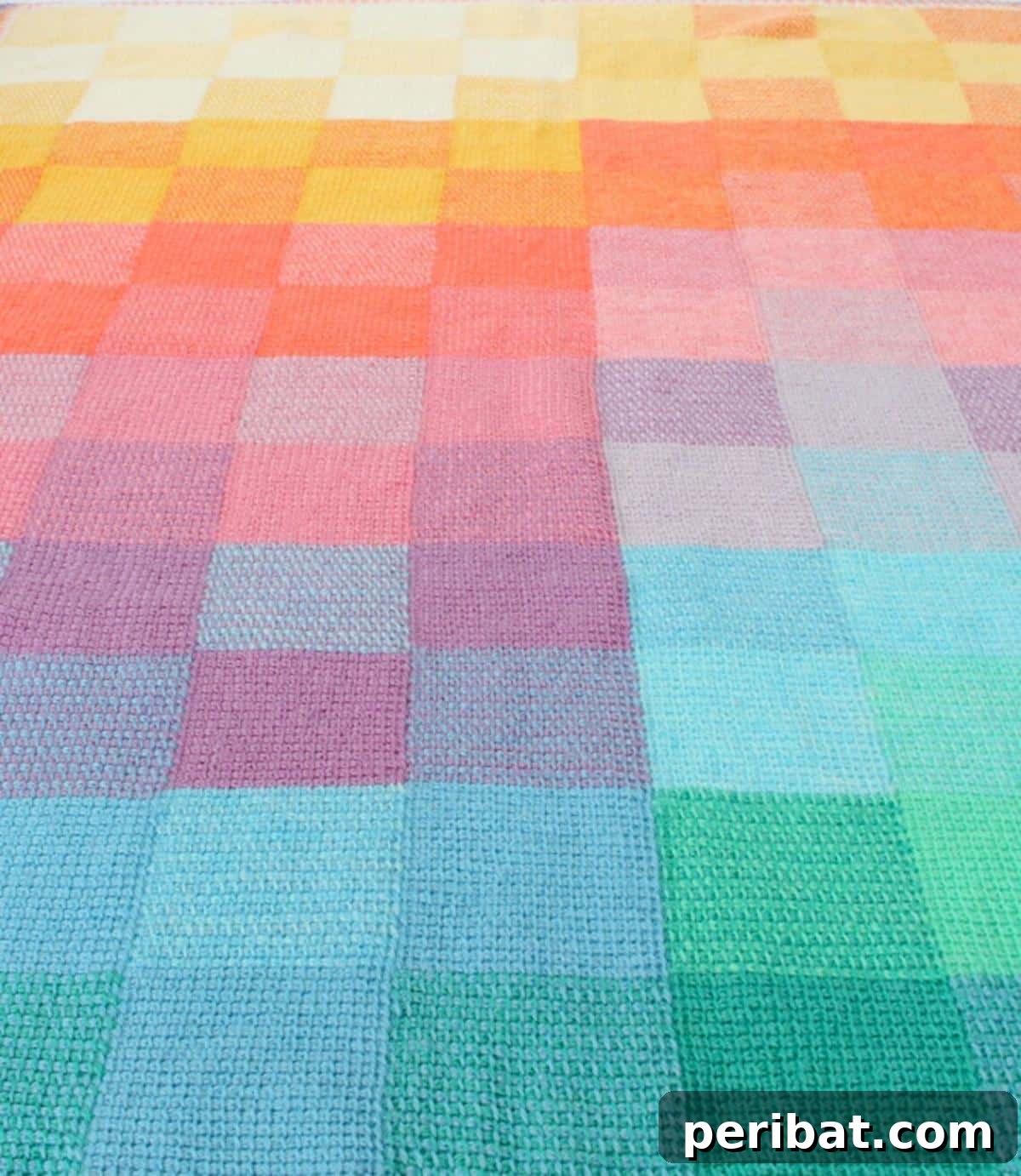 29 Beautiful Tunisian Crochet Projects 30 Tunisian Sunset Crochet Blanket, featuring beautiful color gradients resembling a sunset, perfect for beginners.