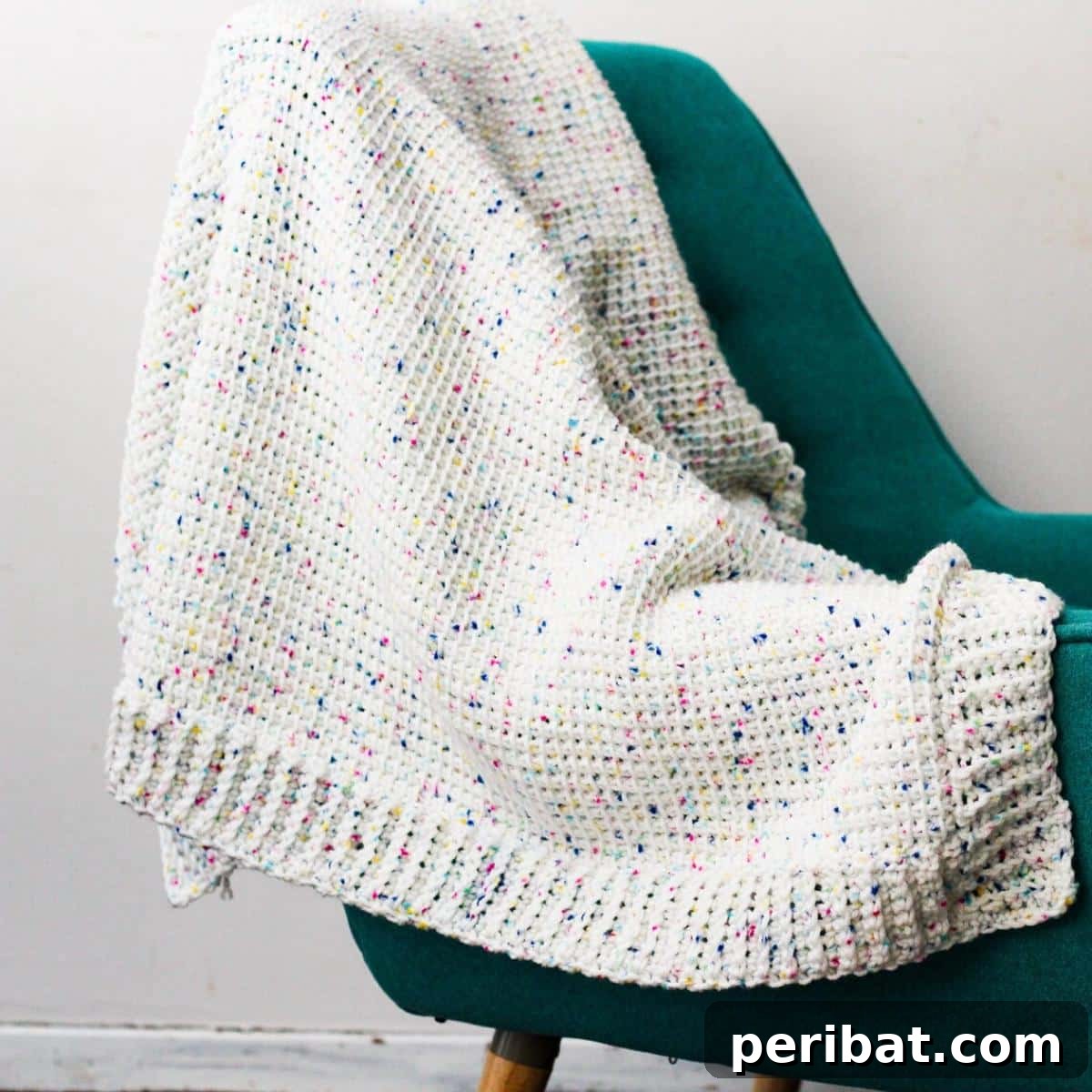 29 Beautiful Tunisian Crochet Projects 31 Tunisian Crochet Confetti Blanket, a versatile design suitable for various sizes and styles, featuring colorful 'confetti' flecks.