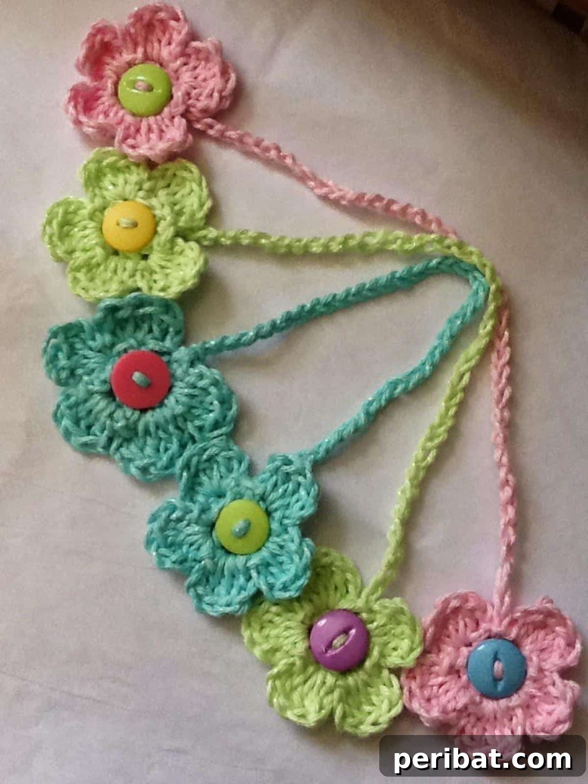 36 Free Crochet Bookmark Designs 32 A lovely Crochet Flower Bookmark with multiple petals, adding floral sweetness to a book.