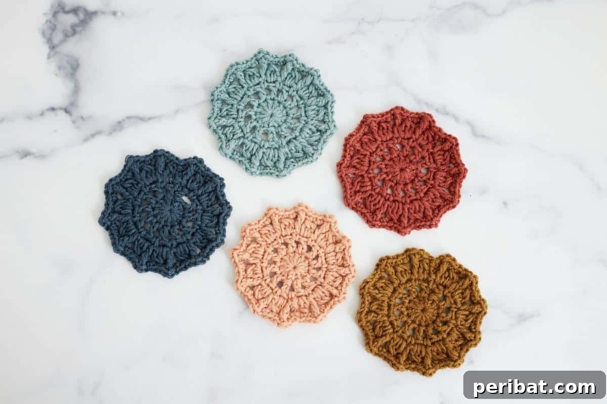 34 Inspiring Crochet Coaster Patterns 26 Vibrant sunburst crochet coasters in a circular pattern, radiating with colorful segments, perfect for parties.