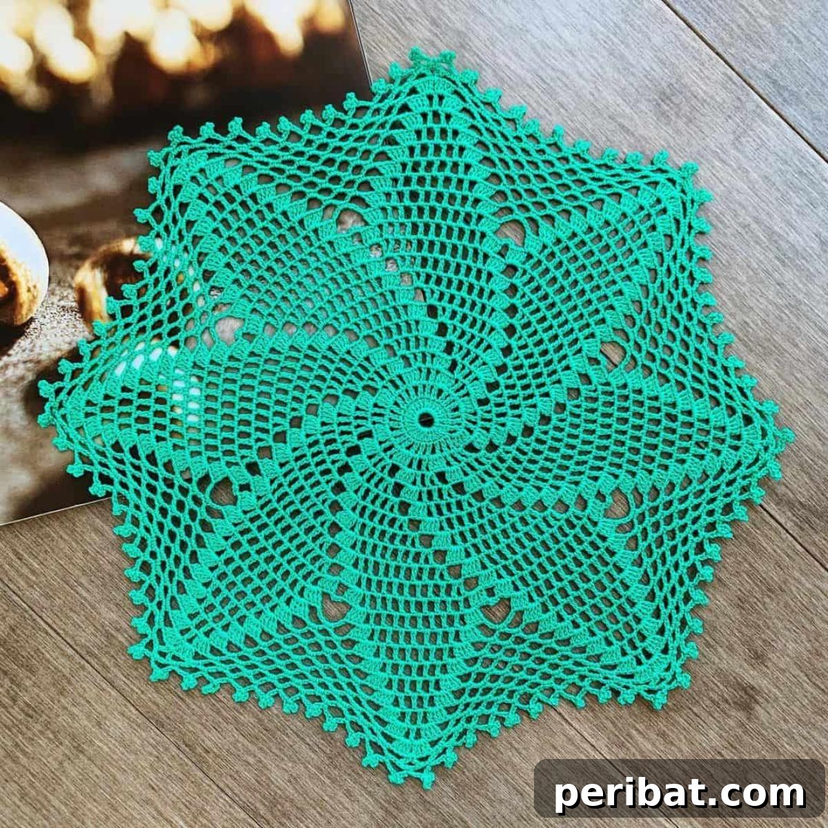 34 Inspiring Crochet Coaster Patterns 27 An intricate spiral star doily crochet coaster, featuring a delicate star shape with a captivating spiral design.