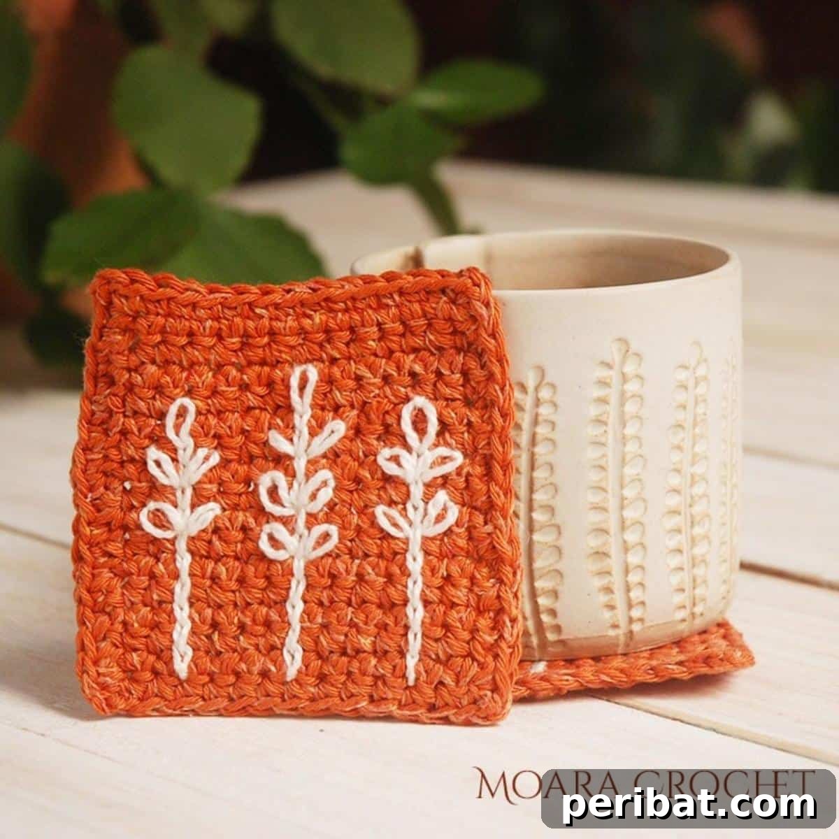 34 Inspiring Crochet Coaster Patterns 29 Elegant simple crochet coasters in neutral tones, showcasing a minimalist design that complements handmade pottery.