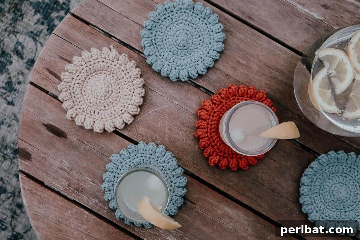 34 Inspiring Crochet Coaster Patterns 4 A stack of super simple round crochet coasters in varying solid colors, showcasing a beginner-friendly design.