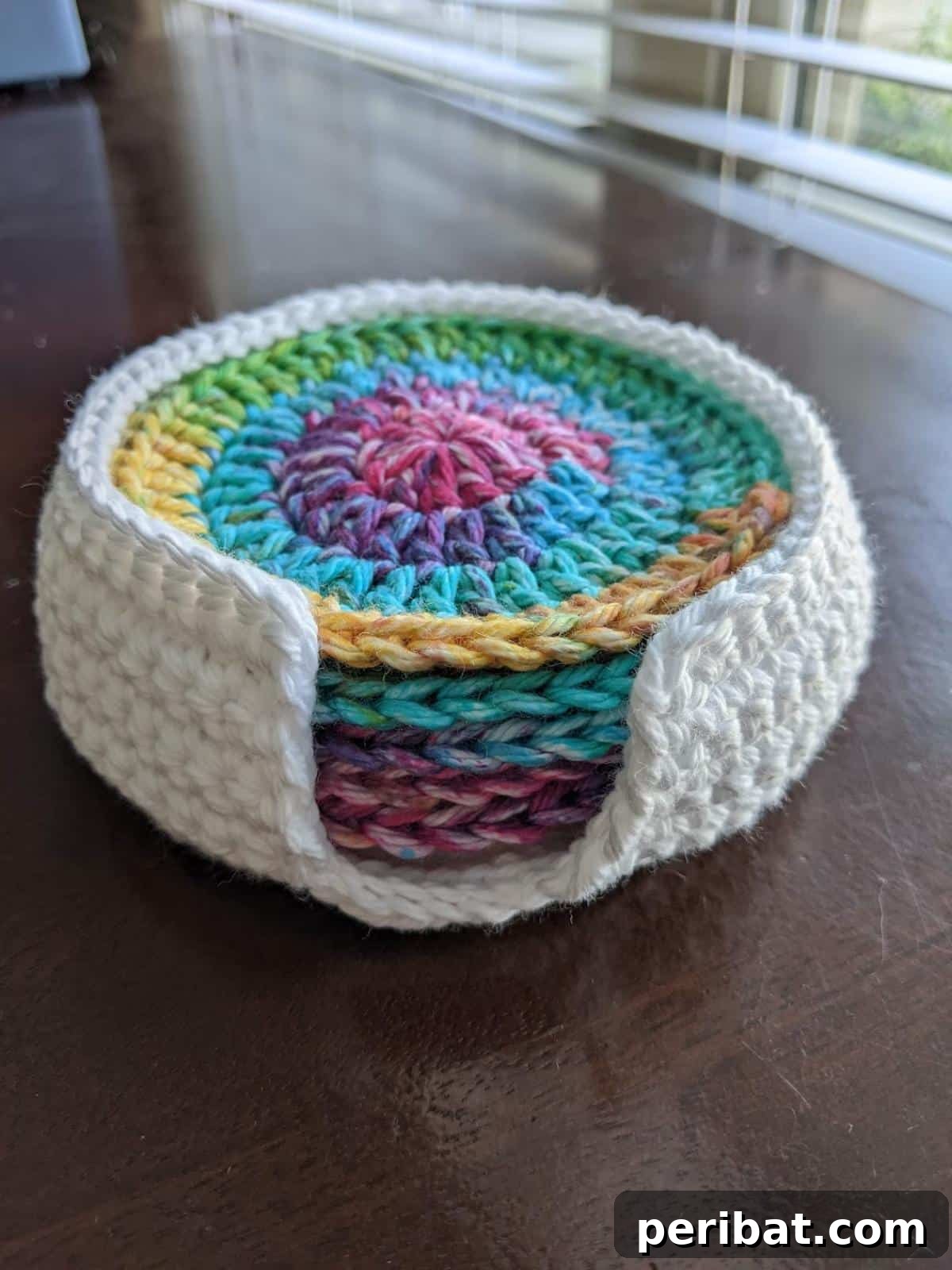 34 Inspiring Crochet Coaster Patterns 34 A practical crochet coaster and matching coaster holder set, showcasing neat organization and handcrafted charm.