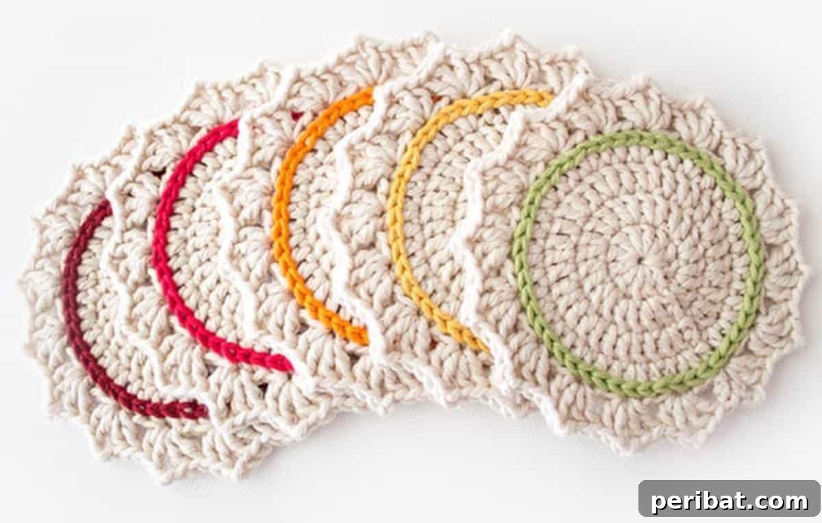 34 Inspiring Crochet Coaster Patterns 6 A set of ombre crocheted coasters displaying smooth color transitions from dark to light in shades of blue and green.