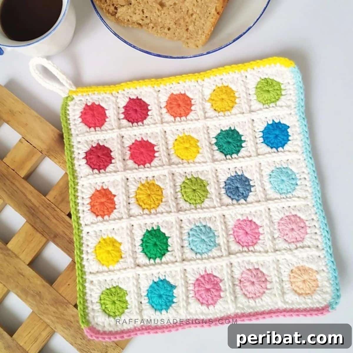 A cheerful crochet scrappy dots potholder, ingeniously made from colorful yarn remnants, creating a vibrant confetti pattern.