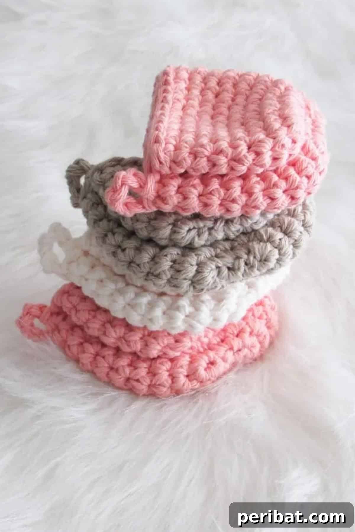 A pair of uniquely designed mini mitts potholders, offering compact and practical hand protection for quick and safe kitchen tasks.
