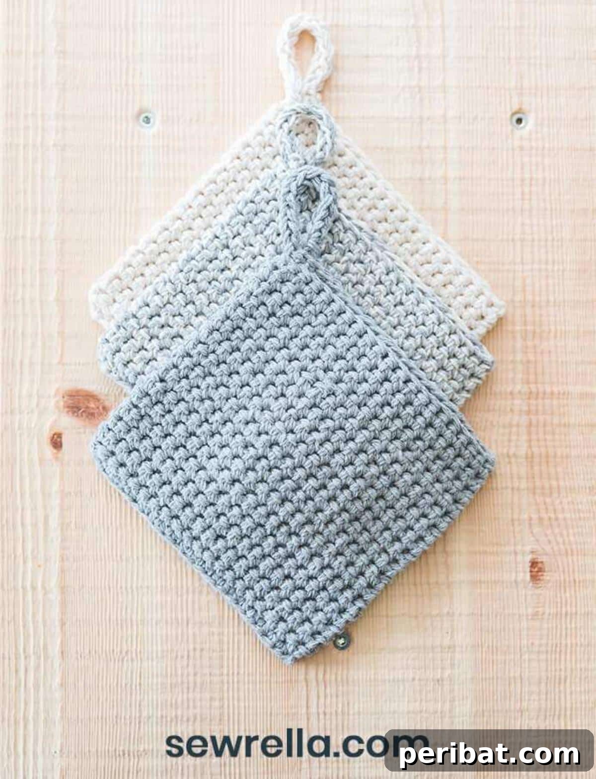 Close-up of a double thick crochet potholder, showcasing its dense, textured thermal stitch in a neutral tone, ideal for hot pans.