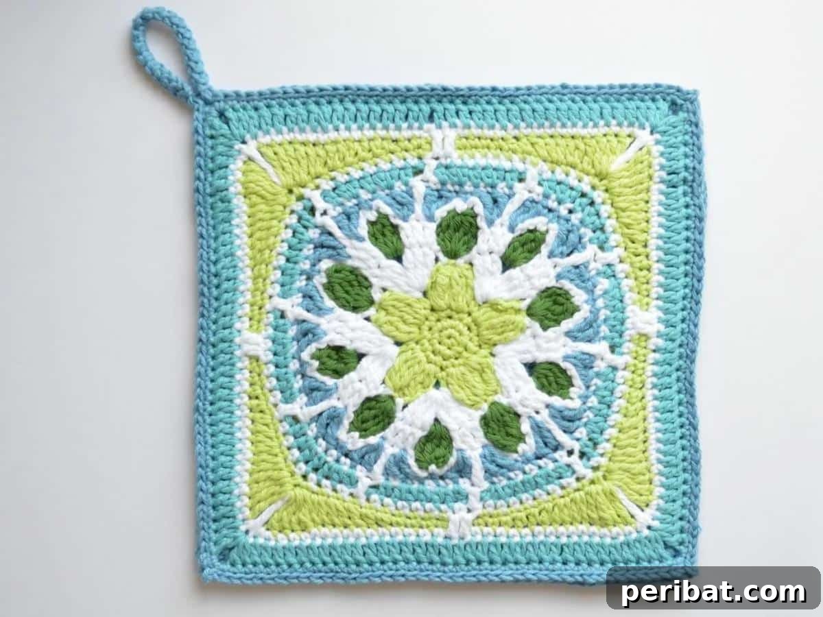 A classic vintage-inspired granny square pot holder, showcasing a delicate design and nostalgic appeal in soft, coordinating colors.