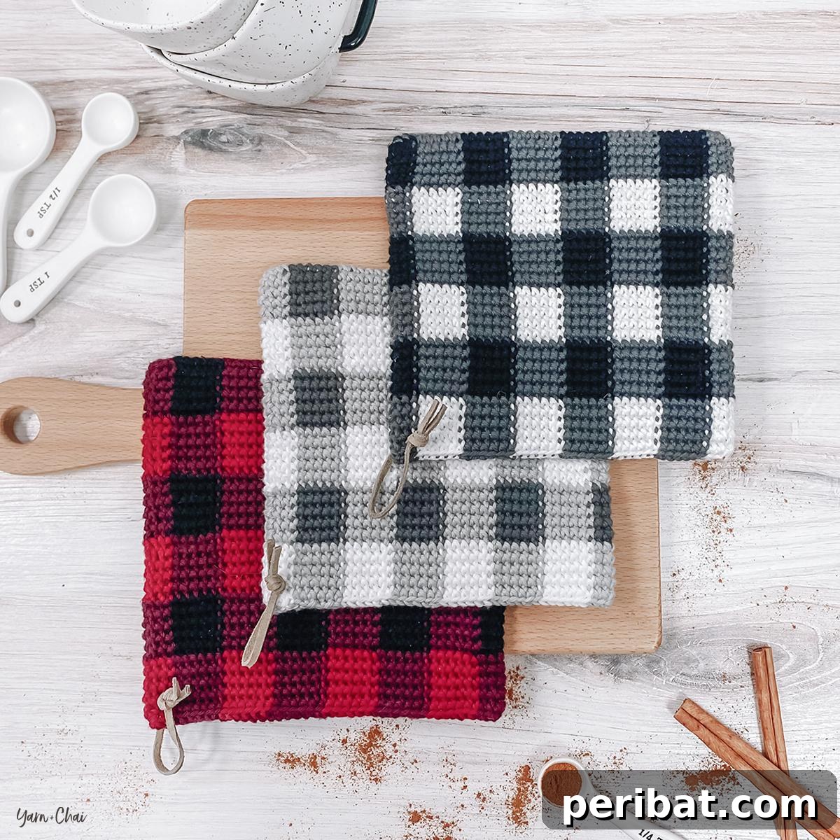 Two charming buffalo check crochet potholders, featuring classic red and black plaid design, evoking cozy, rustic vibes.