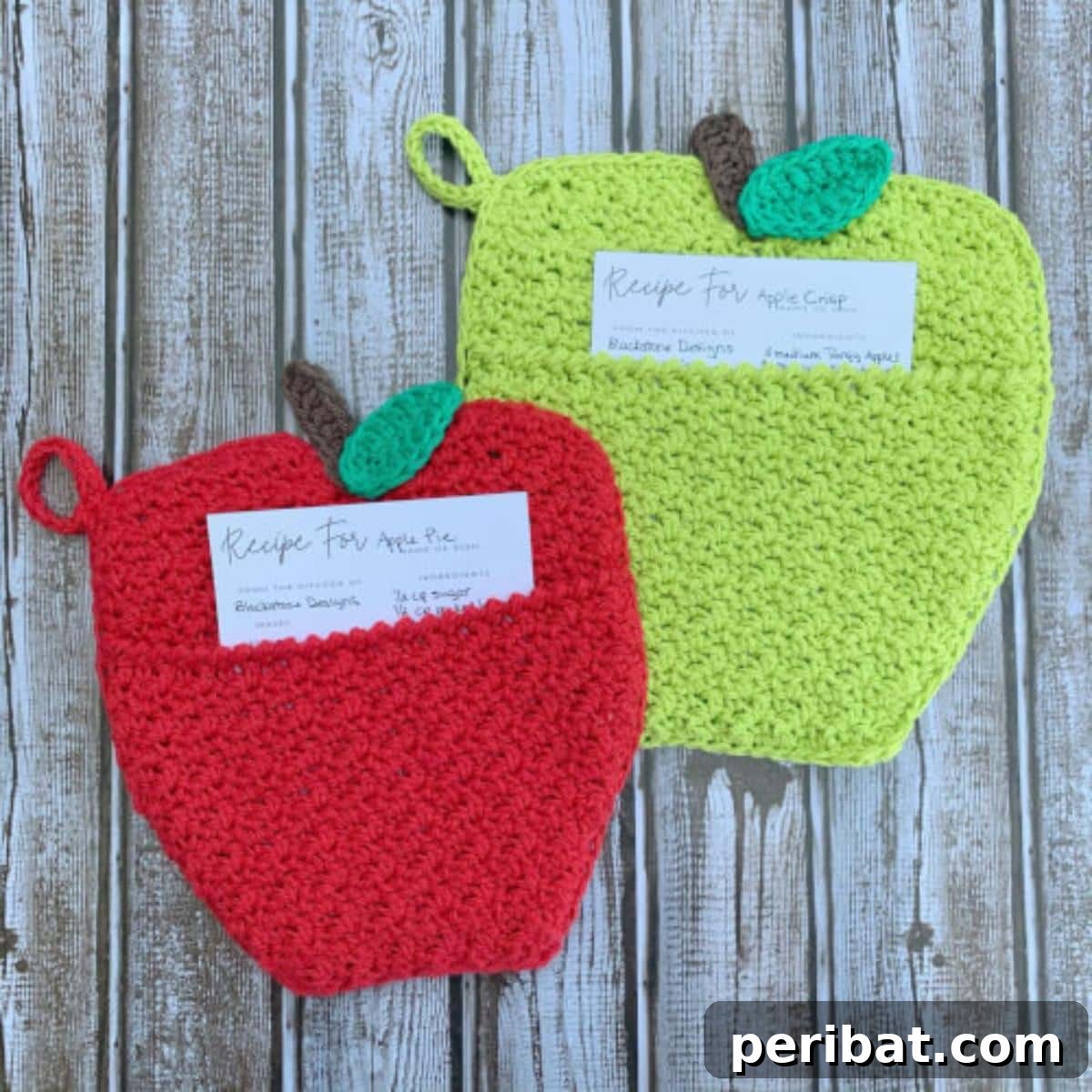 An adorable apple-shaped pot holder with a cheerful red design and a green leaf detail, perfect as a teacher's gift.