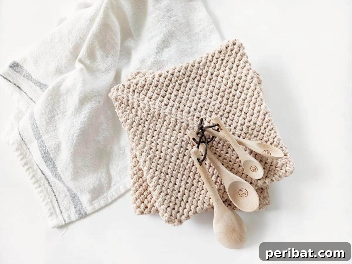 A set of modern double thick crochet potholders in contemporary colors, emphasizing their minimalist design and high heat protection.