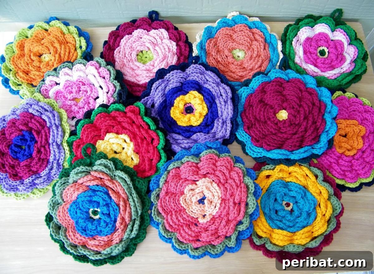 A vibrant and playful fanciful flower crochet potholder, with layers of petals in bright yellow and pink, adding a cheerful touch.