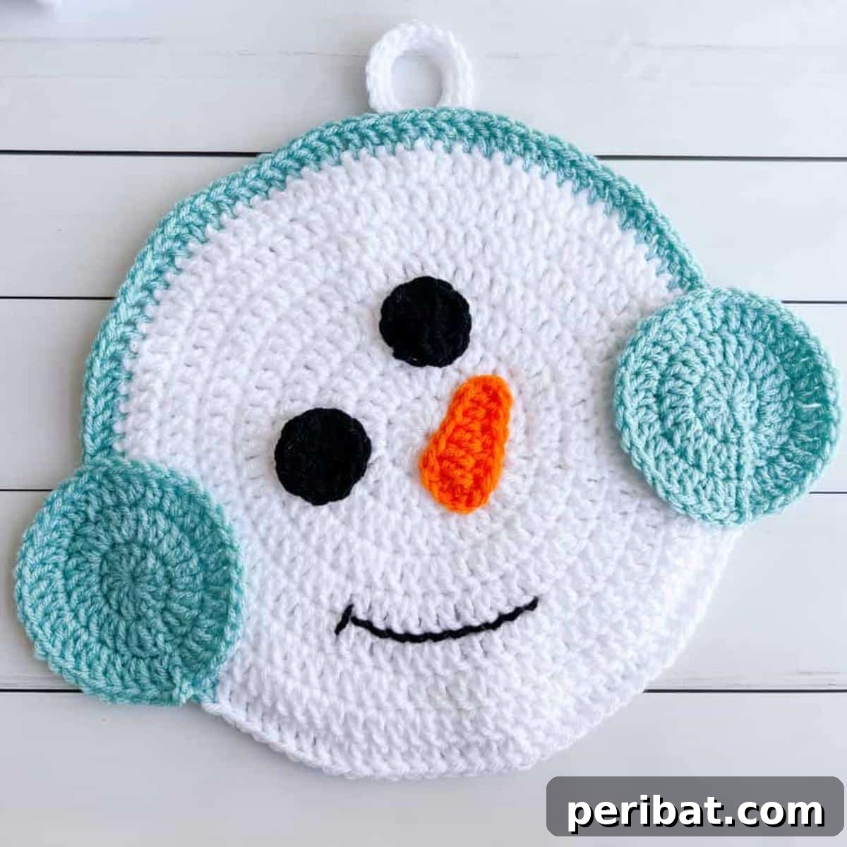 Two adorable crochet snowman hot pads, complete with hats and scarves, bringing festive winter cheer to the kitchen.