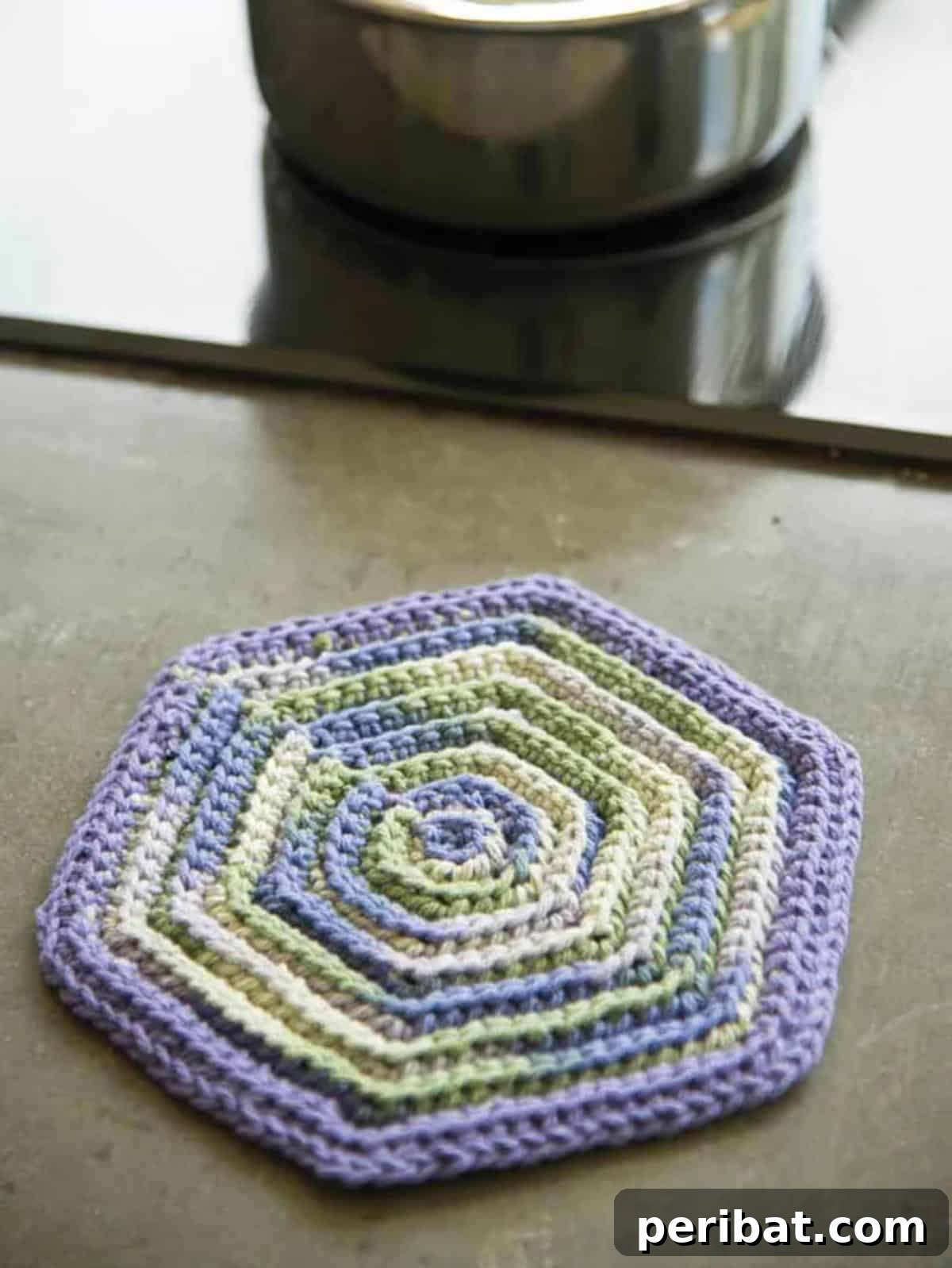 A beautifully textured crochet vintage hot pad, crafted with simple stitches to create a classic and timeless design.