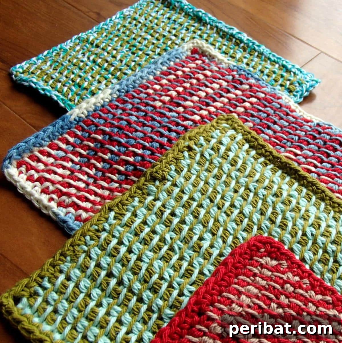 A modern two-color Tunisian crochet potholder, displaying a dense, woven-like texture and clear color blocking for a stylish look.